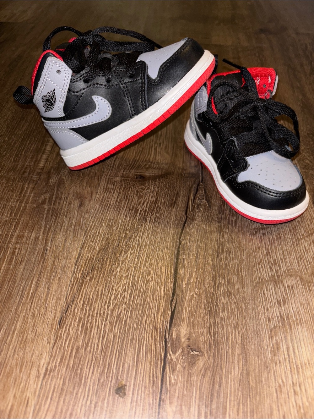 Red, gray, and black Jordan 1 (size 5c)